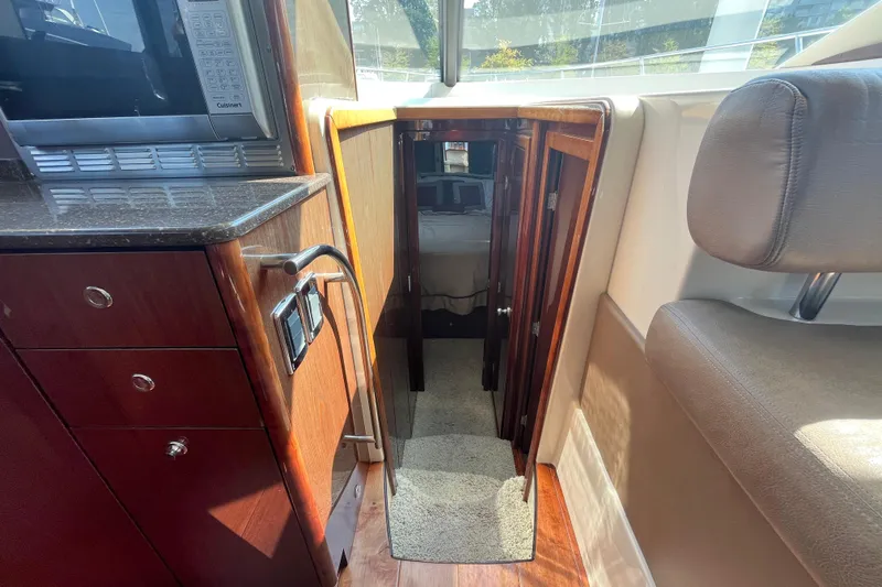  Yacht Photos Pics Interior of 2012 Meridian 441 Sedan yacht, featuring a cozy cabin entrance.