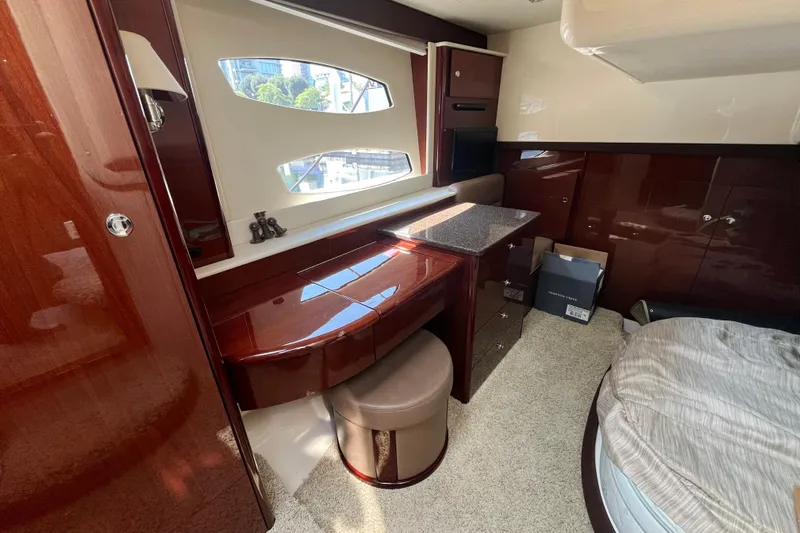  Yacht Photos Pics Luxurious interior of 2012 Meridian 441 Sedan yacht with elegant wood finish and cozy seating.