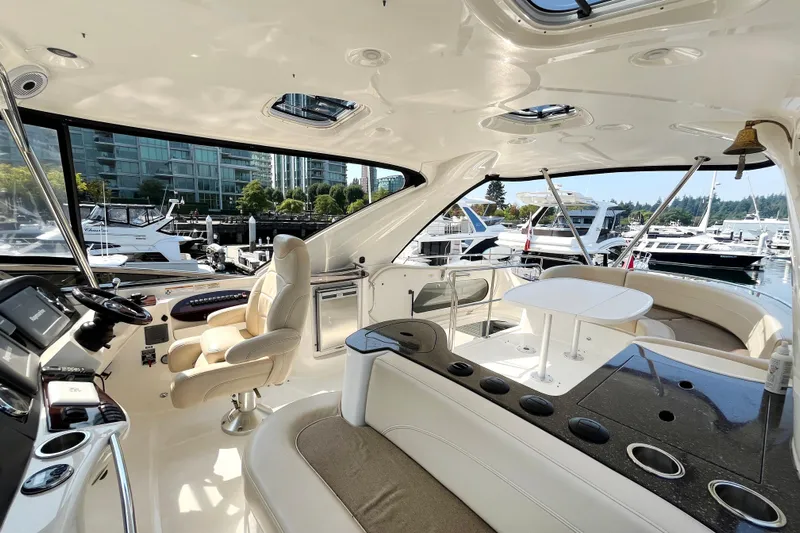  Yacht Photos Pics Luxurious interior of a 2012 Meridian 441 Sedan yacht docked at a marina.