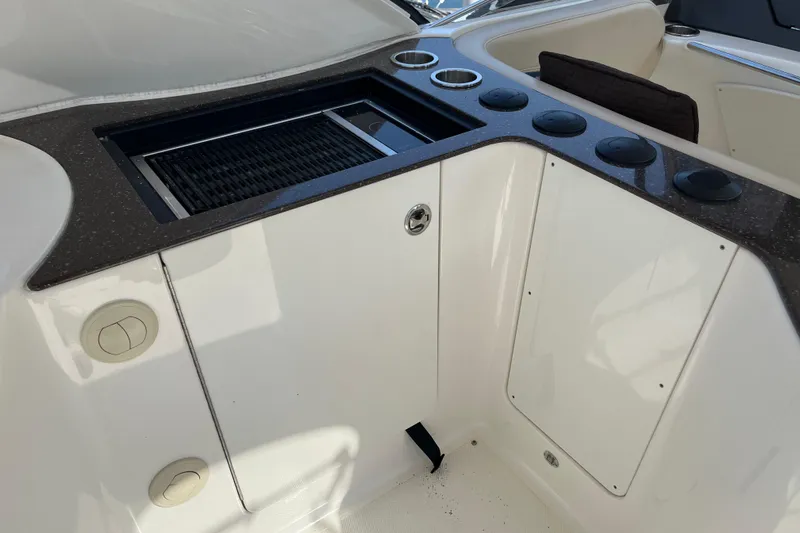  Yacht Photos Pics 2012 Meridian 441 Sedan yacht interior with built-in grill and cup holders.