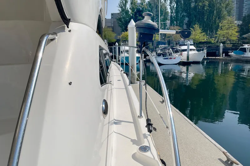  Yacht Photos Pics 2012 Meridian 441 Sedan yacht docked at a marina with surrounding boats.