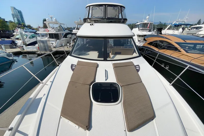  Yacht Photos Pics 2012 Meridian 441 Sedan yacht docked at marina, featuring sun loungers on deck.