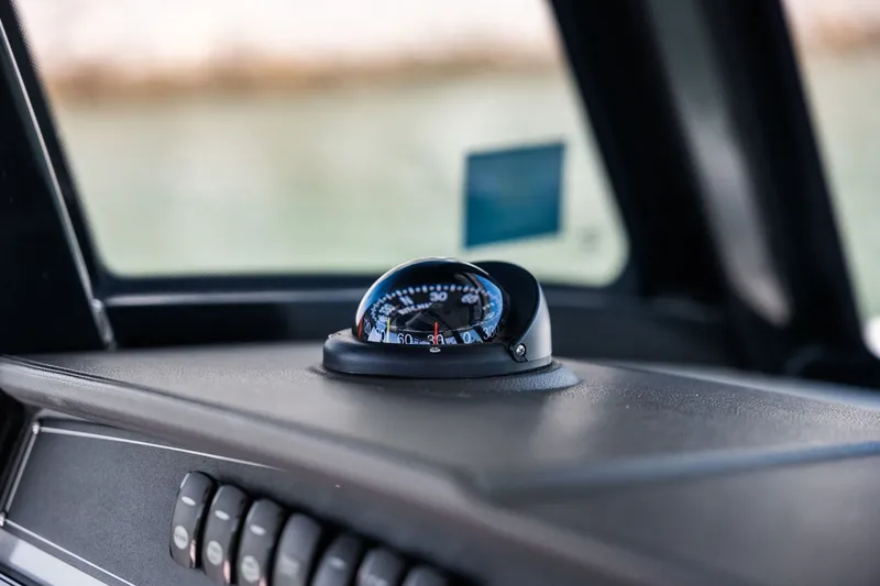  Yacht Photos Pics Compass on 2022 Boston Whaler 330 Outrage dashboard, close-up view.