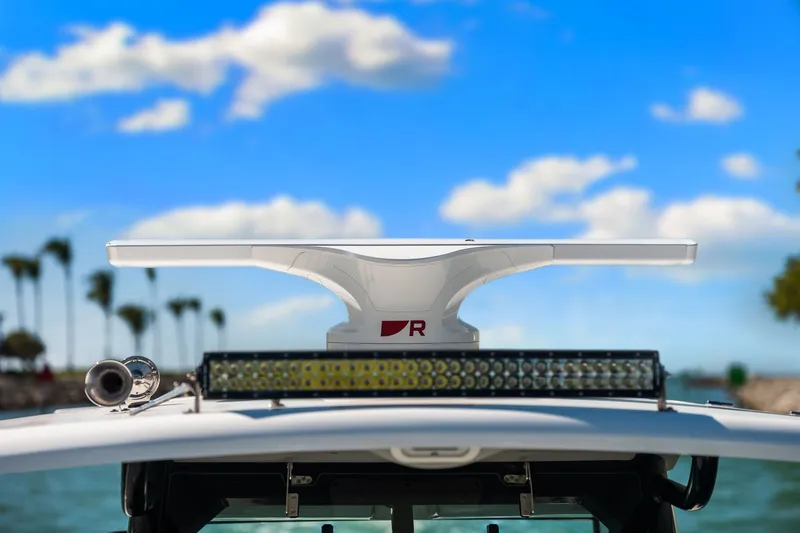  Yacht Photos Pics Radar and light bar on 2022 Boston Whaler 330 Outrage against a blue sky.