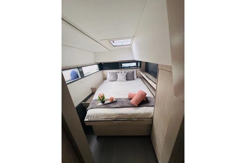 Stargazer Yacht Photos Pics Luxurious cabin interior of 2017 Robertson and Caine Leopard yacht with cozy bed and decor.