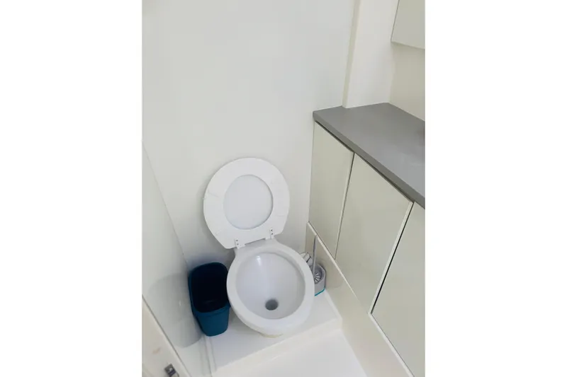 Stargazer Yacht Photos Pics Modern bathroom on 2017 Robertson and Caine Leopard yacht, featuring toilet and storage cabinets.