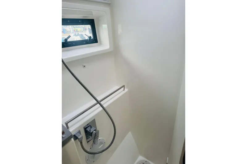 Stargazer Yacht Photos Pics 2017 Robertson and Caine Leopard yacht shower interior with window and modern fixtures.