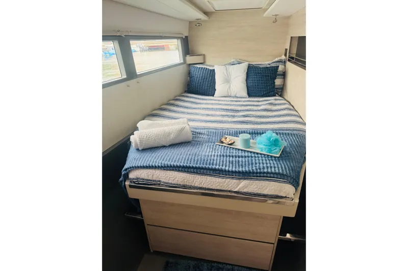 Stargazer Yacht Photos Pics Cozy bedroom in 2017 Robertson and Caine Leopard yacht with blue bedding and decorative pillows.