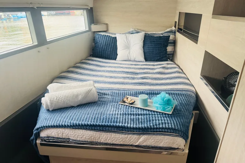 Stargazer Yacht Photos Pics Cozy cabin bedroom in 2017 Robertson and Caine Leopard yacht with striped bedding and decor.