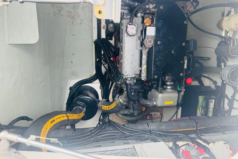 Stargazer Yacht Photos Pics Engine compartment of a 2017 Robertson and Caine Leopard boat, showcasing mechanical components.