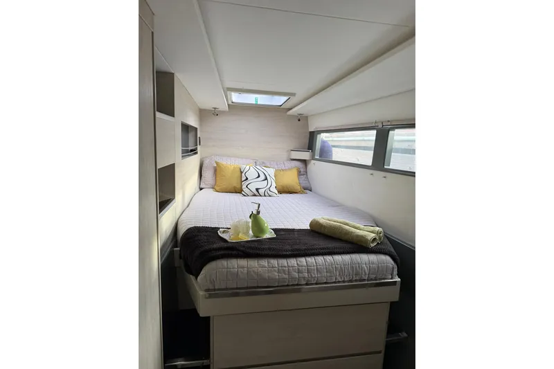 Stargazer Yacht Photos Pics Luxurious cabin interior of 2017 Robertson and Caine Leopard yacht with cozy bed and decor.