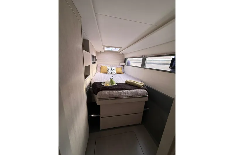 Stargazer Yacht Photos Pics Luxurious cabin interior of 2017 Robertson and Caine Leopard yacht with cozy bedding.