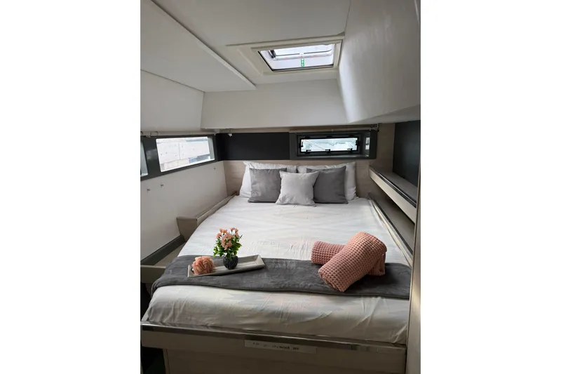 Stargazer Yacht Photos Pics Luxurious cabin interior of 2017 Robertson and Caine Leopard yacht with cozy bedding.