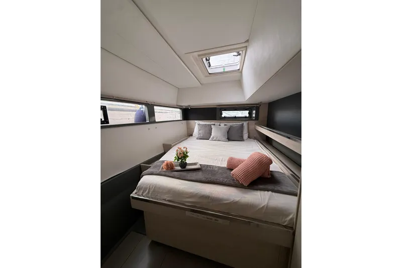 Stargazer Yacht Photos Pics Luxurious cabin interior of 2017 Robertson and Caine Leopard yacht with cozy bedding.