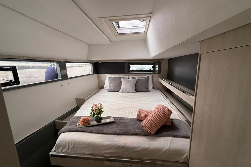 Stargazer Yacht Photos Pics Luxurious cabin interior of 2017 Robertson and Caine Leopard yacht with cozy bed setup.