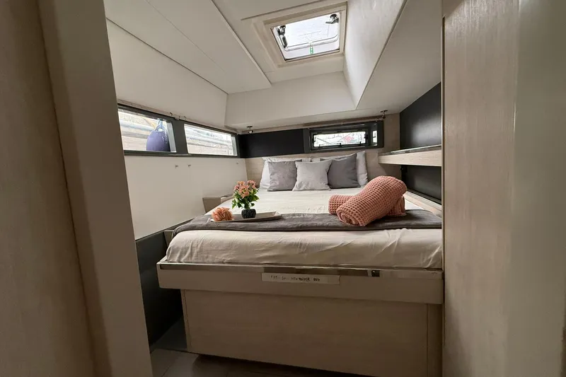 Stargazer Yacht Photos Pics Luxurious cabin interior of a 2017 Robertson and Caine Leopard yacht with cozy bedding.