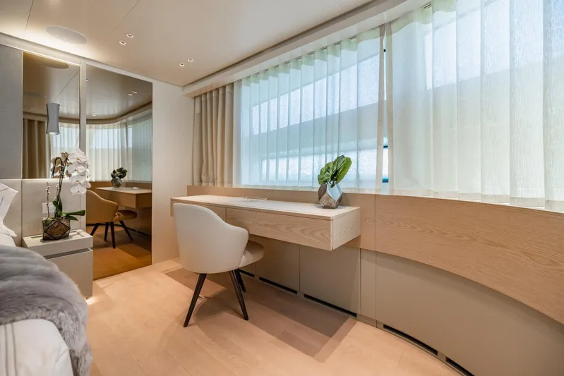 Legacy Yacht Photos Pics Luxurious interior of 2022 Sanlorenzo SD96 yacht with elegant desk and seating area.