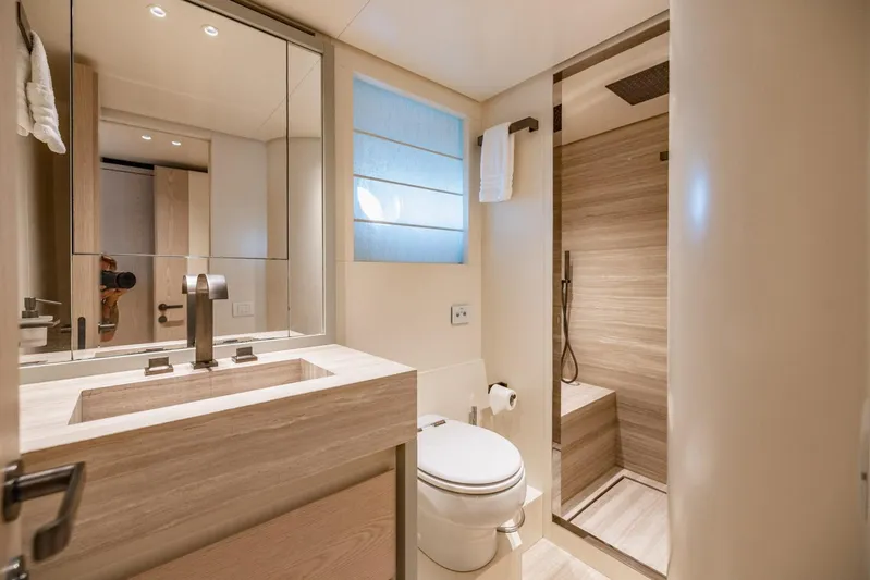 Legacy Yacht Photos Pics Luxurious bathroom in 2022 Sanlorenzo SD96 yacht, featuring modern fixtures and elegant design.