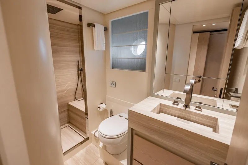 Legacy Yacht Photos Pics Luxurious bathroom in 2022 Sanlorenzo SD96 yacht, featuring modern fixtures and elegant design.