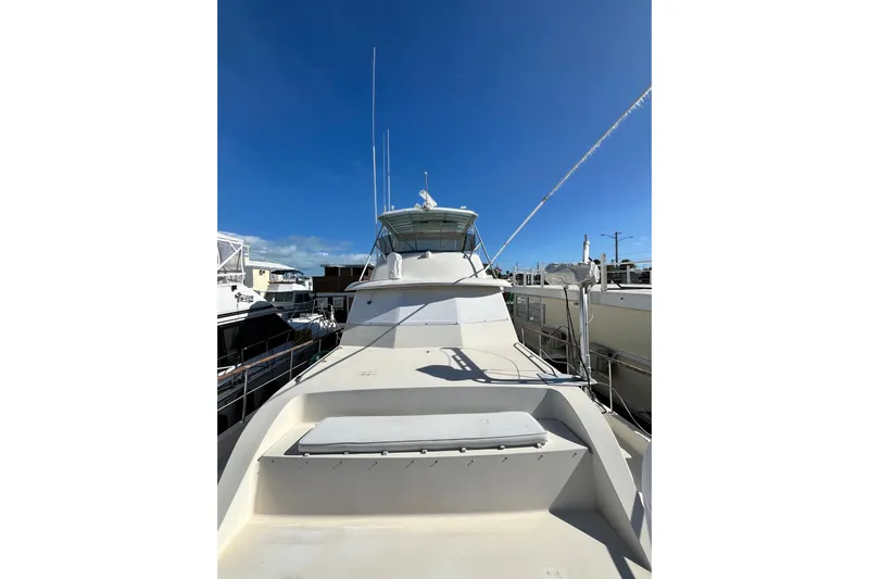  Yacht Photos Pics 1978 Hatteras 53 Yacht Fisherman docked under clear blue sky.