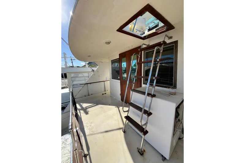  Yacht Photos Pics 1978 Hatteras 53 Yacht Fisherman deck with ladder and wooden door.