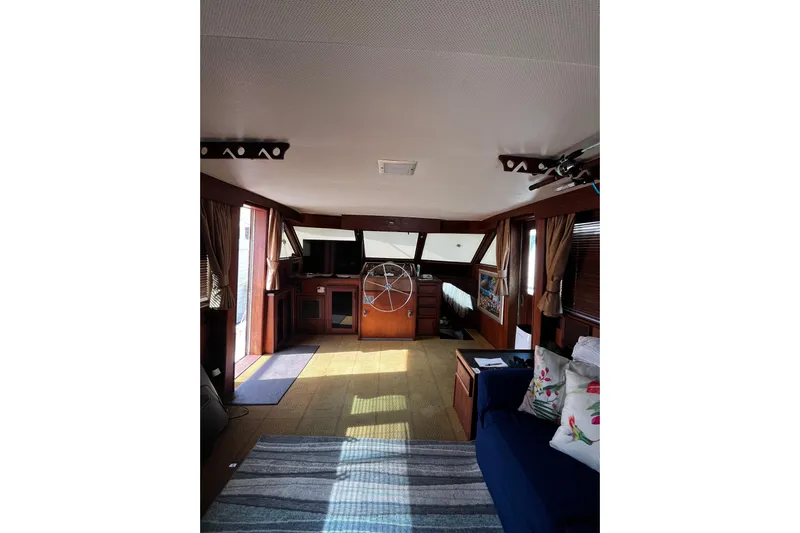  Yacht Photos Pics Interior of 1978 Hatteras 53 Yacht Fisherman with cozy seating and nautical decor.