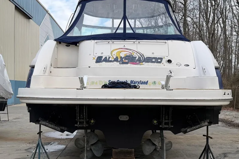 Galaxsea 500 Yacht Photos Pics 2004 Sea Ray 500 Sundancer yacht on stands, rear view, in a boatyard setting.
