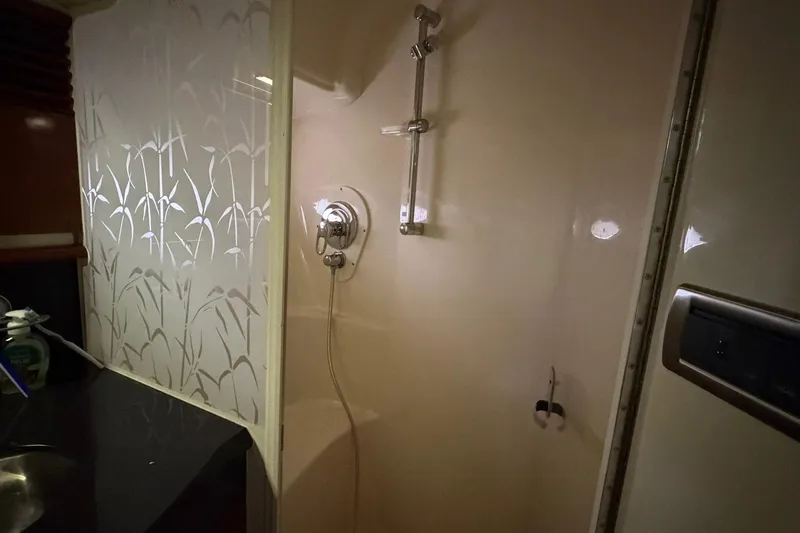 Galaxsea 500 Yacht Photos Pics Shower area inside 2004 Sea Ray 500 Sundancer yacht, featuring elegant floral design.