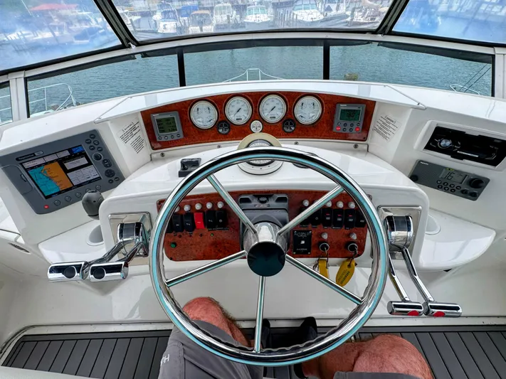  Yacht Photos Pics 2005 Silverton 35 Motor Yacht helm with navigation instruments and steering wheel.