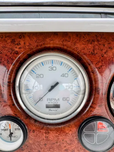  Yacht Photos Pics Close-up of 2005 Silverton 35 Motor Yacht RPM gauge on wooden dashboard.