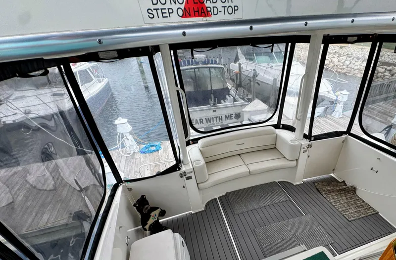  Yacht Photos Pics 2005 Silverton 35 Motor Yacht interior with dock view and seating area.