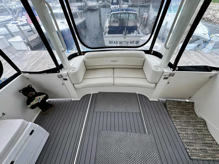  Yacht Photos Pics 2005 Silverton 35 Motor Yacht interior with white seating and nautical decor.