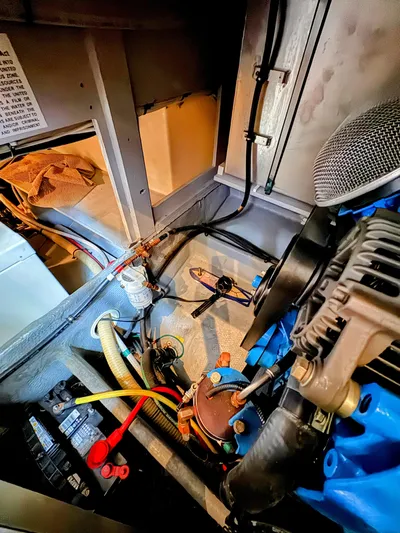  Yacht Photos Pics Engine room of a 2005 Silverton 35 Motor Yacht, showcasing mechanical components and wiring.