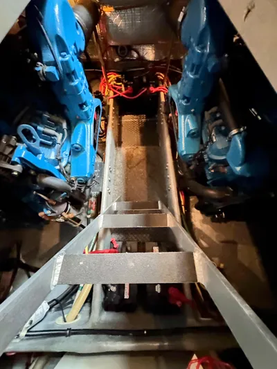  Yacht Photos Pics Engine room of 2005 Silverton 35 Motor Yacht with visible blue engines and ladder.