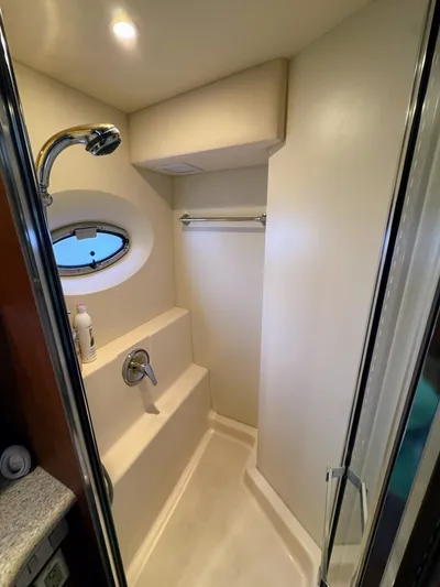  Yacht Photos Pics Shower area in 2005 Silverton 35 Motor Yacht with porthole and modern fixtures.
