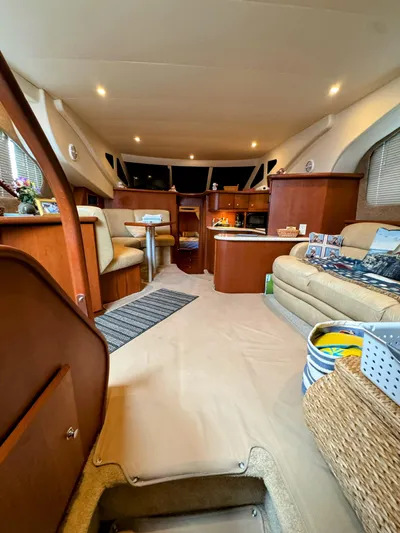  Yacht Photos Pics Interior of 2005 Silverton 35 Motor Yacht with cozy seating and elegant wood finishes.