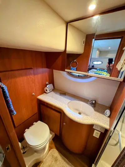  Yacht Photos Pics Bathroom interior of 2005 Silverton 35 Motor Yacht with sink, toilet, and mirror.
