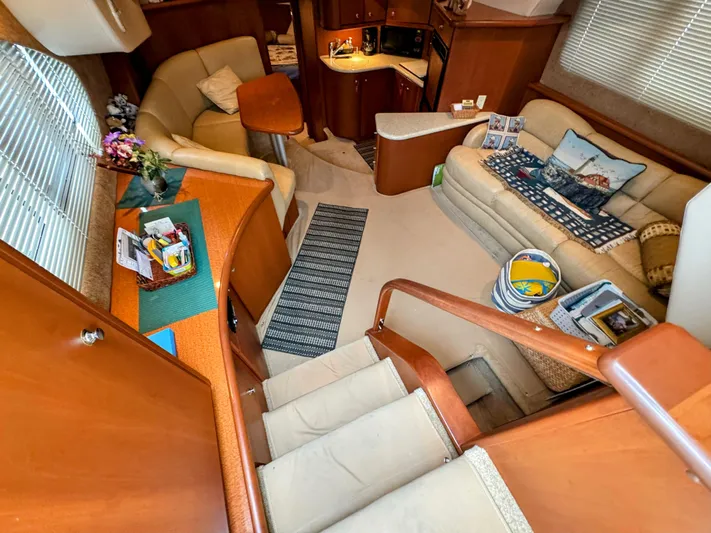 Yacht Photos Pics Interior of 2005 Silverton 35 Motor Yacht with cozy seating and elegant wood finishes.
