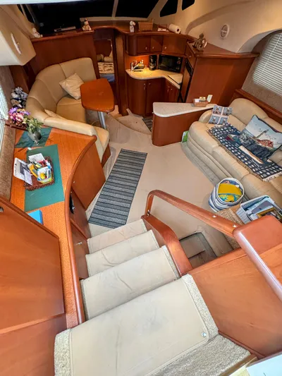  Yacht Photos Pics Interior of 2005 Silverton 35 Motor Yacht, featuring cozy seating and compact kitchen area.