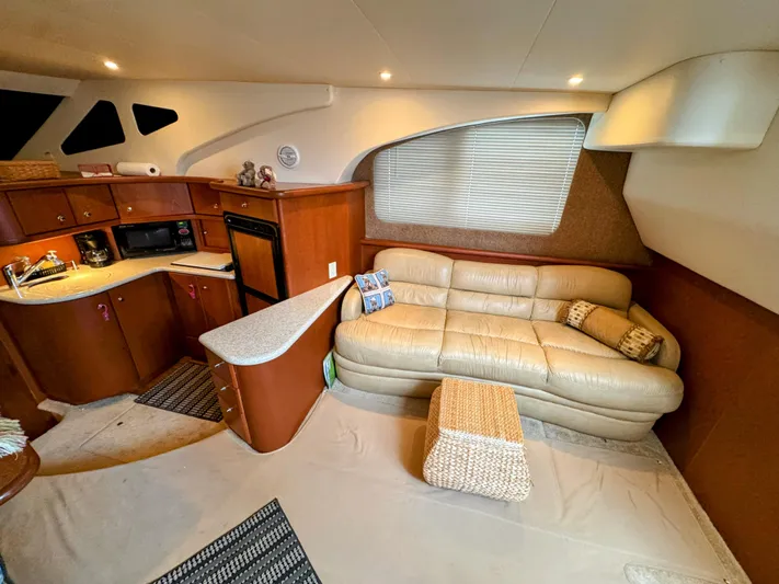  Yacht Photos Pics Interior of 2005 Silverton 35 Motor Yacht with leather sofa, kitchenette, and modern amenities.