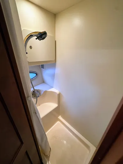  Yacht Photos Pics Shower area in 2005 Silverton 35 Motor Yacht, featuring compact design and handheld showerhead.