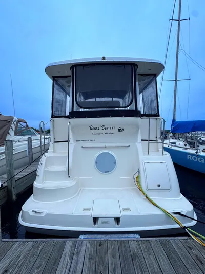  Yacht Photos Pics 2005 Silverton 35 Motor Yacht docked, rear view with name "Bear's Den III."