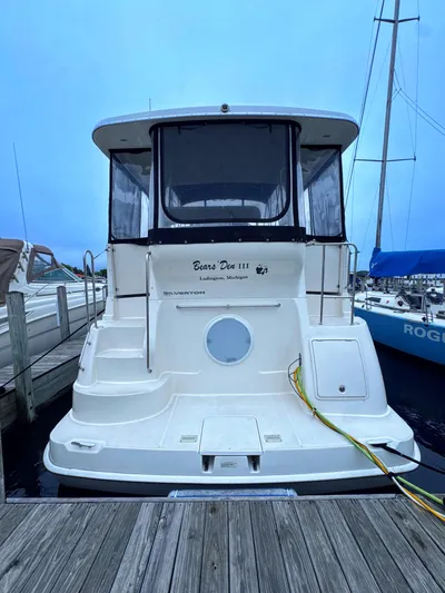  Yacht Photos Pics 2005 Silverton 35 Motor Yacht docked at marina, rear view.