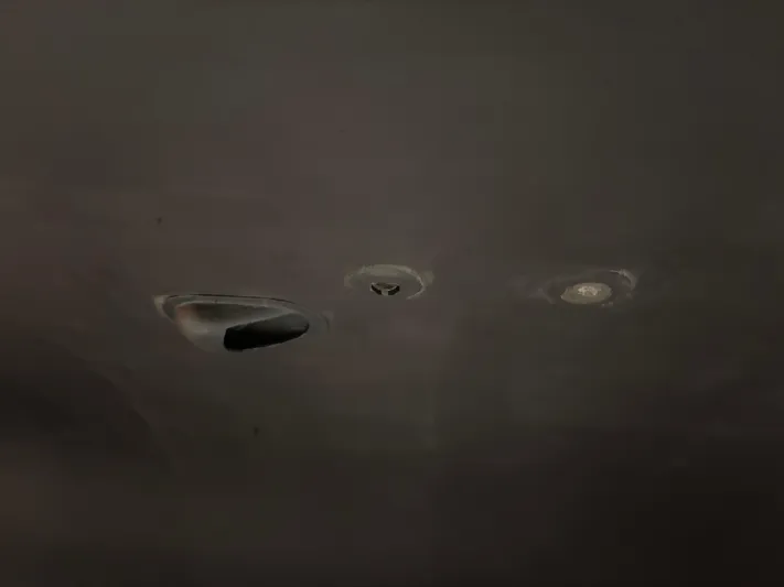 Lucy Yacht Photos Pics Dents on a 2006 Ellis Express vehicle surface.