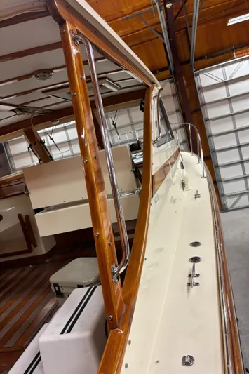 Lucy Yacht Photos Pics 2006 Ellis Express boat interior with polished wood and sleek design in a garage setting.