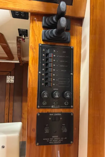 Lucy Yacht Photos Pics Control panel of a 2006 Ellis Express boat with switches and seat controls.