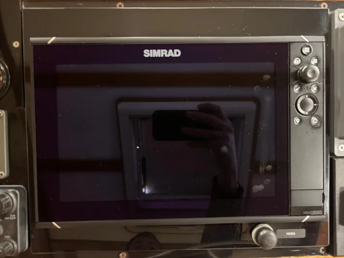 Lucy Yacht Photos Pics Simrad marine navigation system on 2006 Ellis Express boat dashboard.