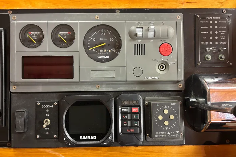 Lucy Yacht Photos Pics Control panel of a 2006 Ellis Express boat featuring Yanmar and Simrad instruments.