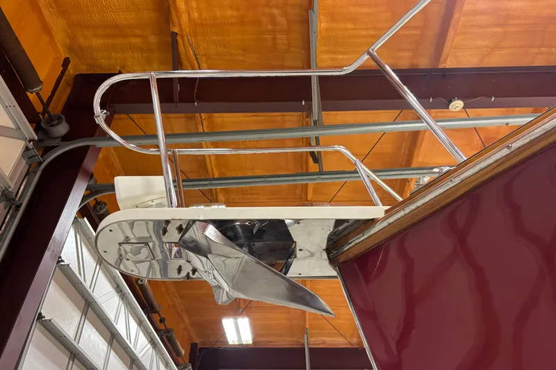 Lucy Yacht Photos Pics 2006 Ellis Express boat propeller and railing in a workshop setting.