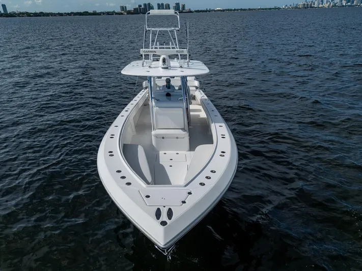 The Hogfather Yacht Photos Pics 2015 Bahama 41 boat on open water, showcasing sleek design and spacious deck.